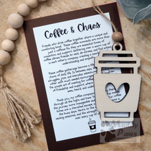 Load image into Gallery viewer, A whimsical wooden coffee cup ornament with a heart cut out with an inspirational friendship message card for friends who enjoy sharing coffee and a caffeine fix with friends.