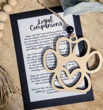Load image into Gallery viewer, Whimsical wooden dog paw shaped ornament with heart cut out and an inspirational message card. honoring the love and loyalty of man's best friend.