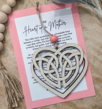 Load image into Gallery viewer, A heart-shaped story charm ornament with a Celtic knot design, symbolizing the unbreakable bond between a mother and her children. Includes a heartwarming keepsake card describing the same.

