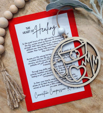 Load image into Gallery viewer, Wooden ornament featuring cut outs related to nursing, including a stethoscope, nurse cap and heartbeat enclosed in a circle with an appreciation message card.
