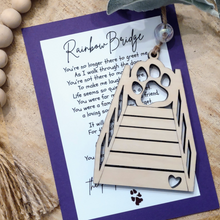 Load image into Gallery viewer, Wooden Rainbow Bridge charm ornament with a dog/cat paw print and a memorial poem message card.
