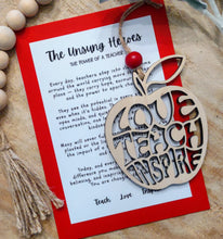 Load image into Gallery viewer, Apple shaped wooden ornament with Love Teach and Inspire carved out with an inspirational message card describing the dedication and difference teachers make.
