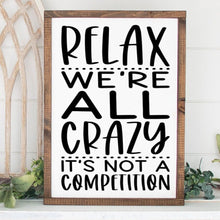 Load image into Gallery viewer, Relax we&#39;re all crazy it&#39;s not a competition handmade painted wood sign

